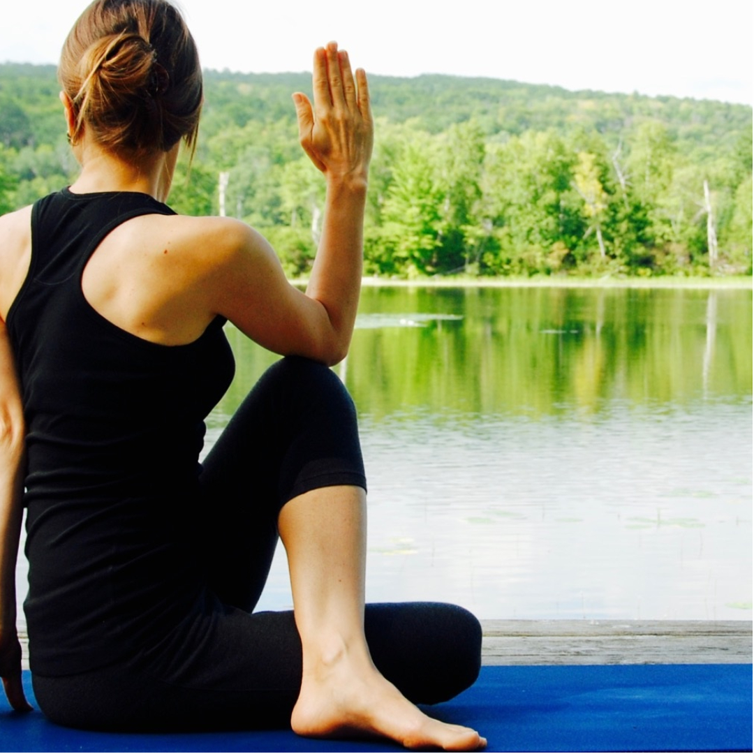 Woman in Yoga Pose and article that discusses Is Detoxing Right for You?